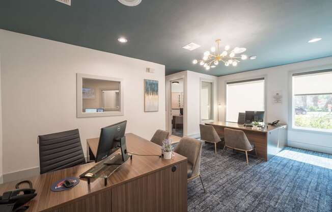 a conference room with a desk and chairs