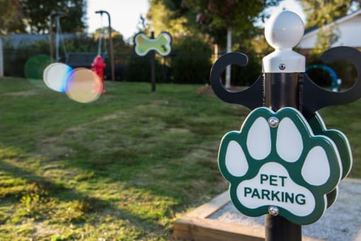 a pet parking sign on a pole in a park at Echo at Lake Norman, Mooresville North Carolina