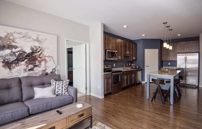 Open Concept Living with Wood Style Flooring Throughout the Kitchen and Living Room