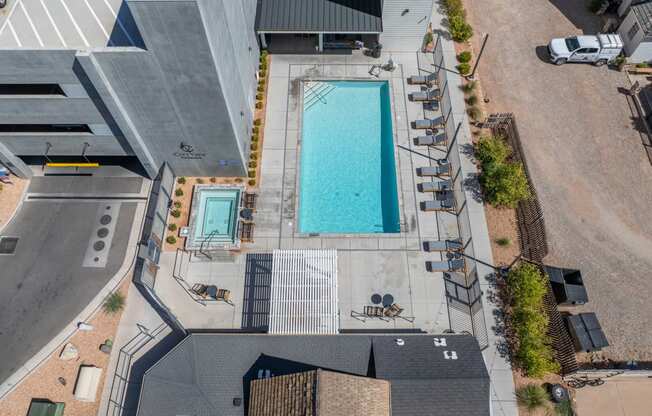 an aerial view of a swimming pool in the middle of a building