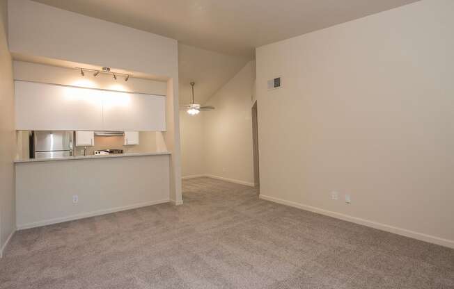 A spacious room with a carpeted floor at Sunset Summit, Rocklin, CA, 95765