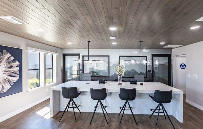 a kitchen and dining room with a large table and chairs