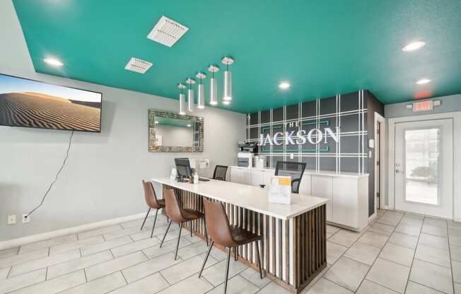 a lobby with a reception desk and chairs