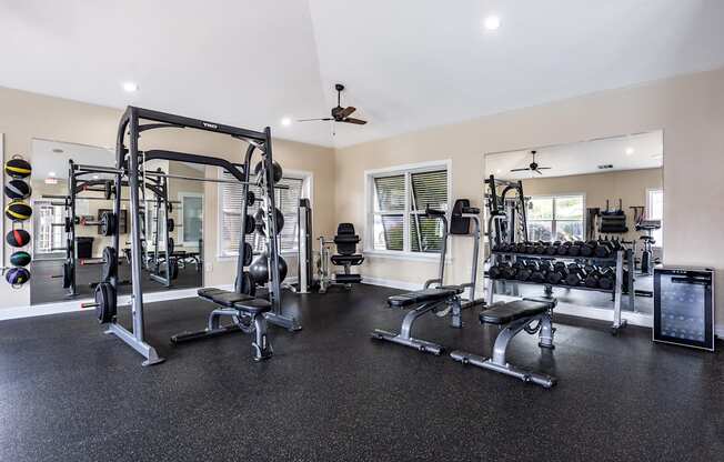 A spacious home gym with a variety of equipment.