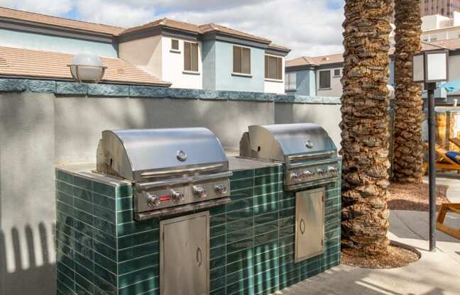 two bbq grills at the enclave at woodbridge apartments in sugar land, tx