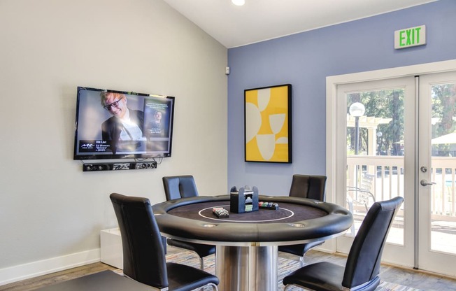 Community clubhouse with gaming table at Renaissance Park Apartments, California