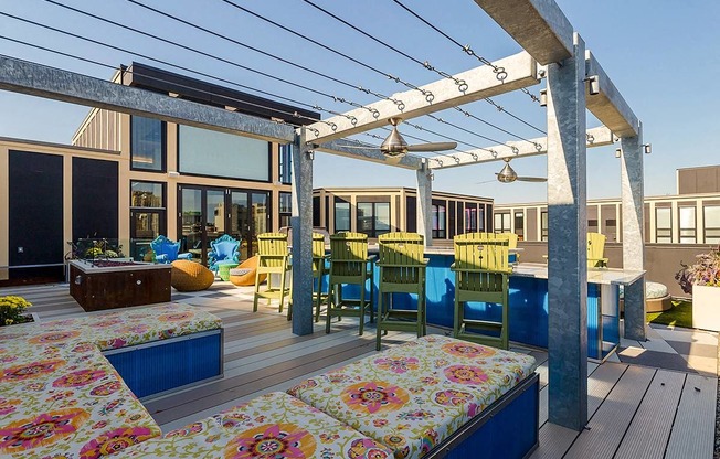 a patio with a table and chairs and a pergola at Ann Arbor City Club, Ann Arbor Michigan