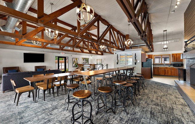 A large room with a long table and chairs.