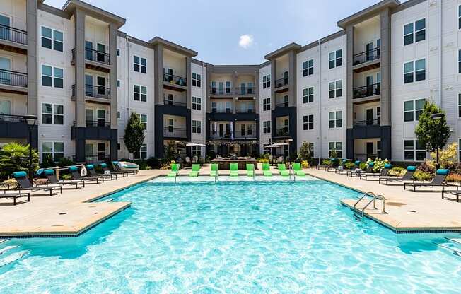 Saltwater pool with aqua sunshelf and sundeck at Berkshire Ballantyne apartments