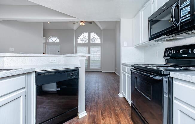 a stove top oven sitting inside of a kitchen