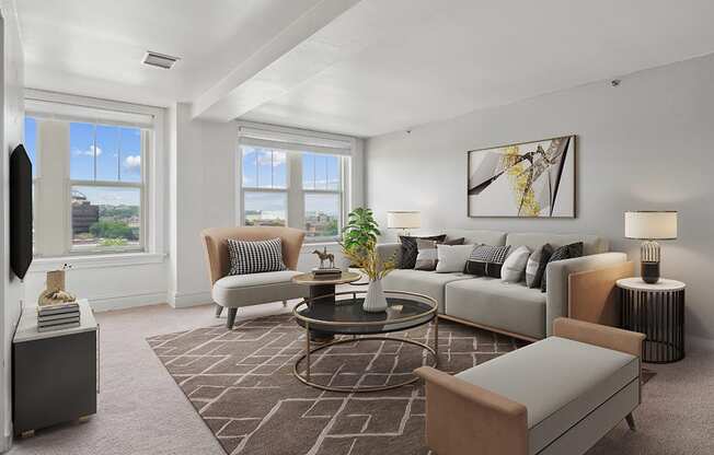 the living room of an apartment with couches and chairs