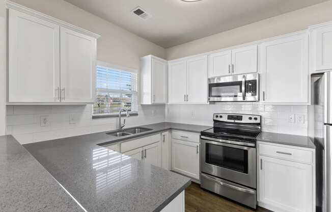 Quartz Countertops and Stainless Steel Appliances in Kitchen