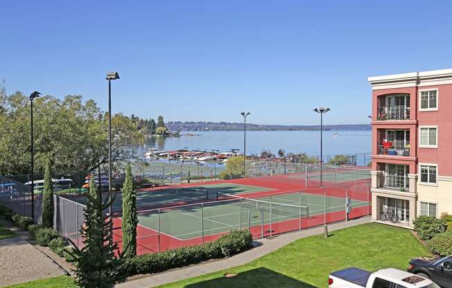 a tennis court at the enclave at woodbridge apartments in sugar land, tx