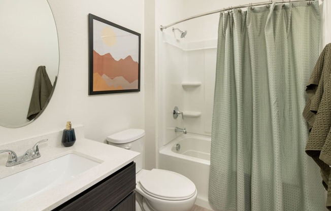 a bathroom with a sink toilet and bathtub