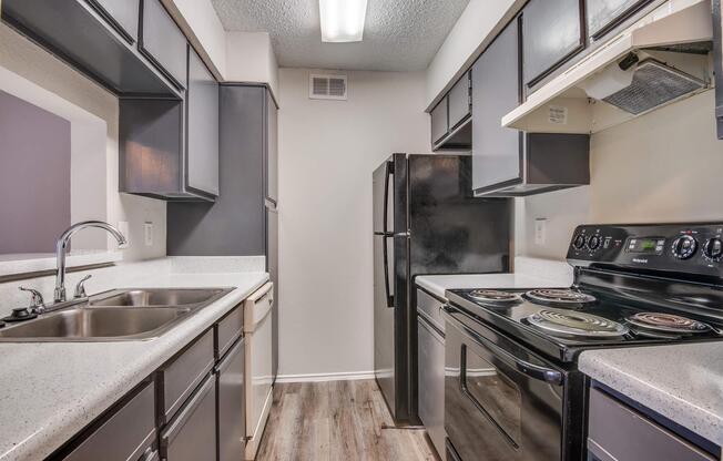 a kitchen with a stove and a sink