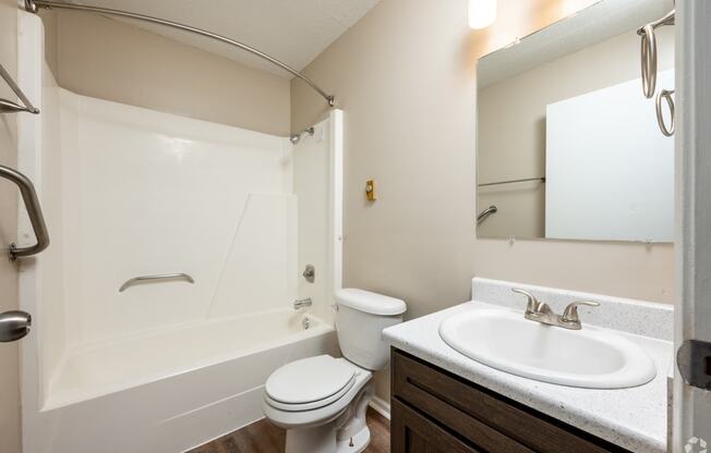 the preserve at ballantyne commons apartment bathroom with sink toilet and shower