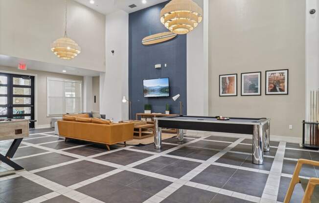 the preserve at ballantyne commons clubhouse with a pool table and tv