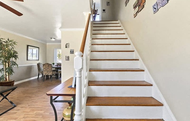 a staircase in a house with a wooden railing