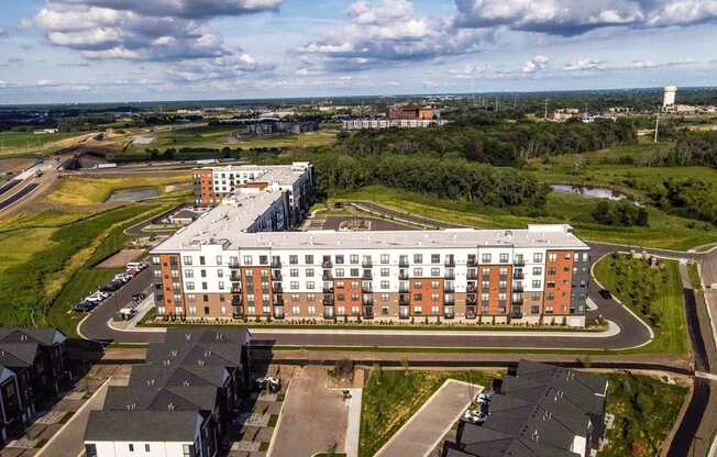 A large building with a parking lot in front of it.