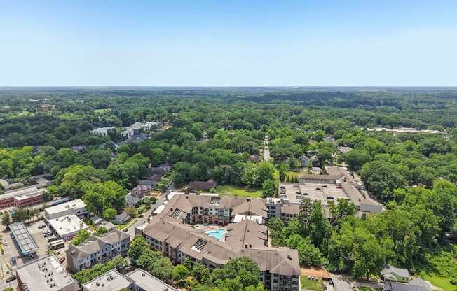 A bird's eye view of a residential area with houses and trees.