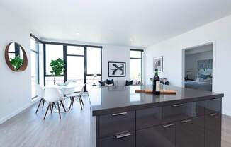 a kitchen island with a bottle of wine on it