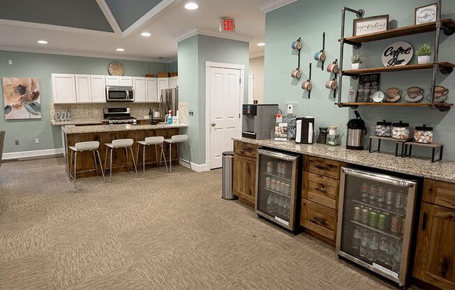 a kitchen with a counter and a bar with stools