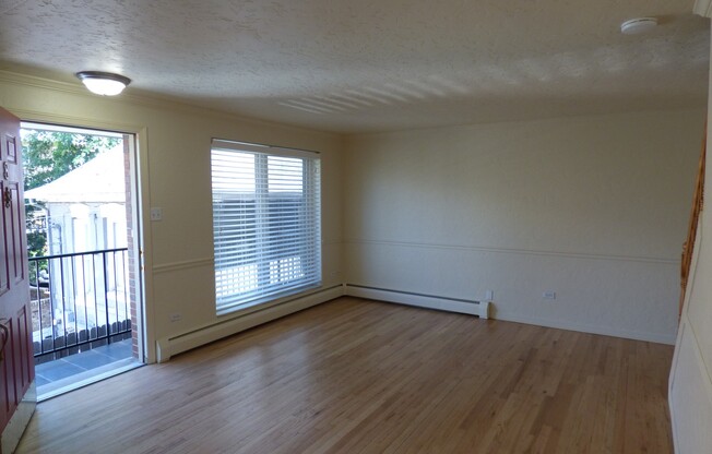 CHEESMAN PARK! TWO STORY CONDO! ADDITIONAL HALF BATH ON MAIN LEVEL! PARKING, HARDWOODS, STORAGE!