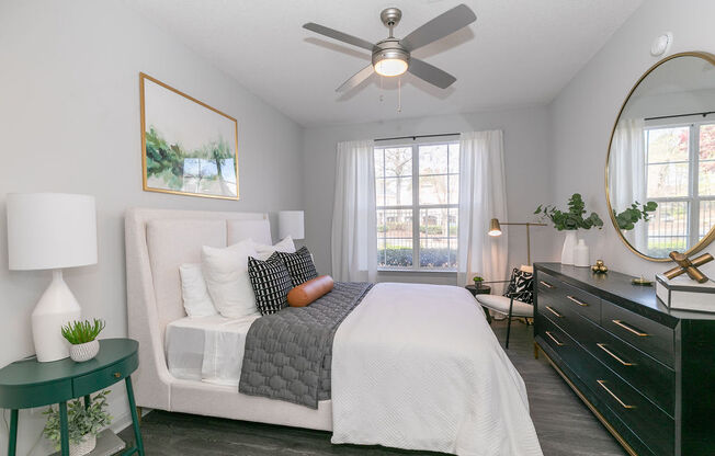 a bedroom with a bed and a ceiling fana bedroom with a bed and a ceiling fan at Deerfield Village, Georgia, 30004