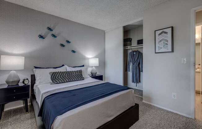 a bedroom with a bed and a nightstand