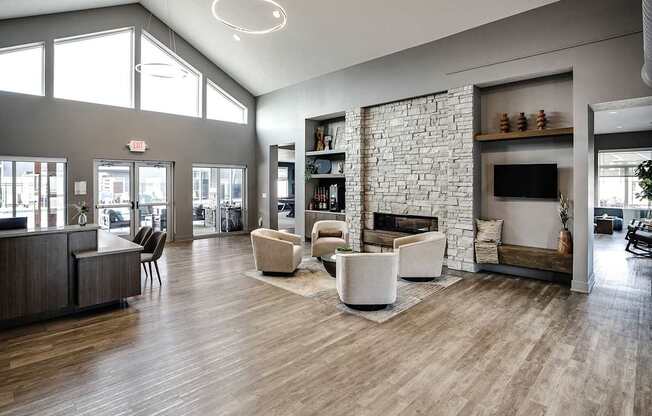 A spacious living room with a fireplace and a bookshelf.