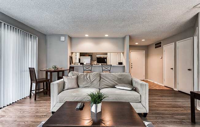 a living room with a couch and a table at The Broadwater at Salado Creek, San Antonio