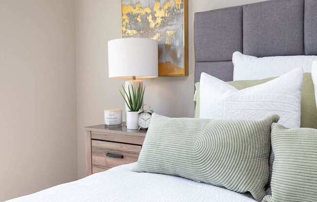 Bedroom With Pillows at Lake Shore Apartments, Ankeny, Iowa