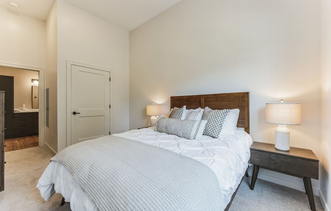 a bedroom with a large bed and a closet