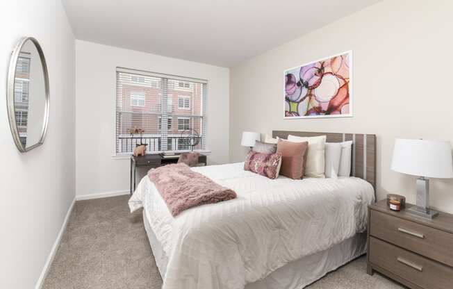 a bedroom with a large bed and a window