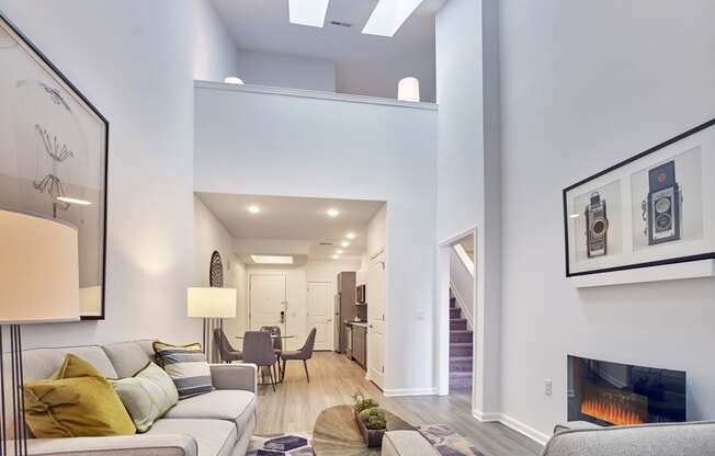 a living room with a couch and a fireplace