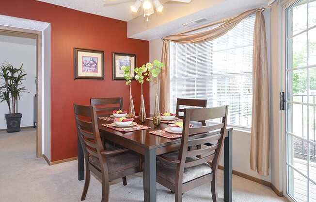 Carpeted Dining room with Large Windows