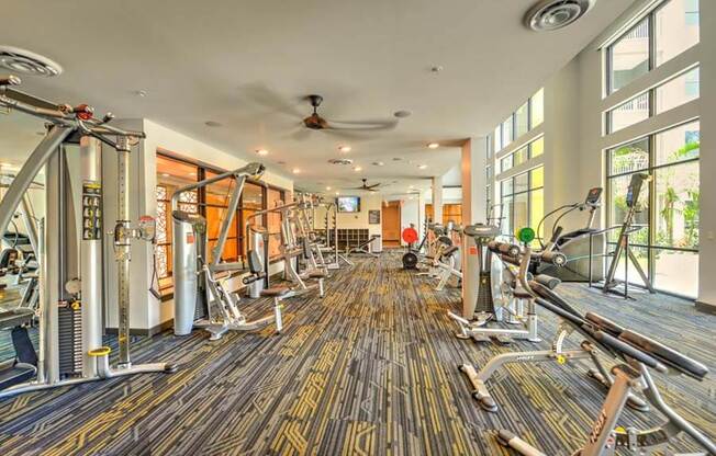 a room filled with lots of different types of exercise equipment  at Fusion, Florida, 32256