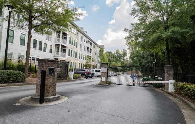 A street view of a gated entrance to a residential building.