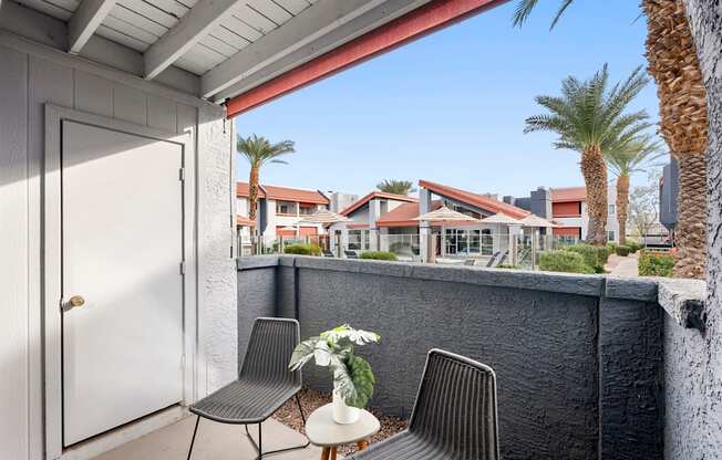 A patio with a table and chairs