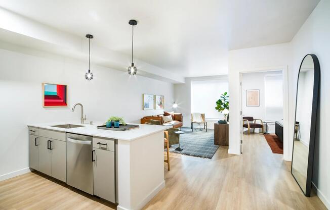 Open-concept living at Modera Shoreline blends sleek design with comfort, offering a bright and versatile space ideal for gatherings or quiet evenings in.