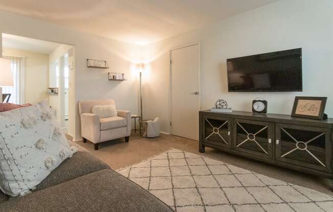 This is a photo of the living room of the 1 bedroom, 631 square foot model apartment at Lake of the Woods Apartments in Cincinnati, OH.