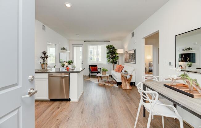 a living room filled with furniture and a large window