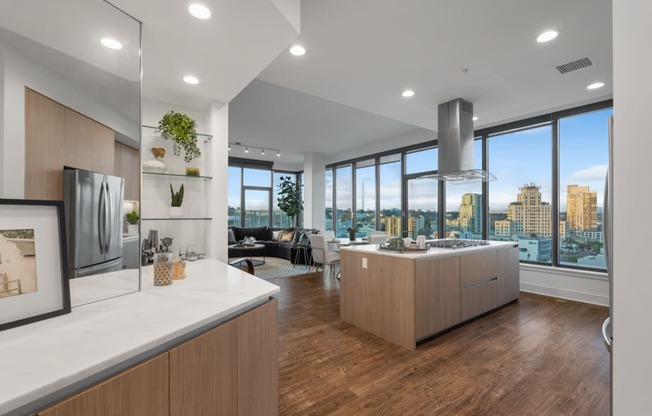 an open kitchen and living room with a view of the city at Stanza Little Italy, California