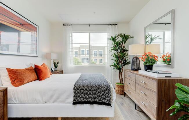 a living room filled with furniture and a large window