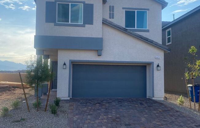 brand-new with two car garages, four bedrooms plus a loft, and two and a half bathrooms.