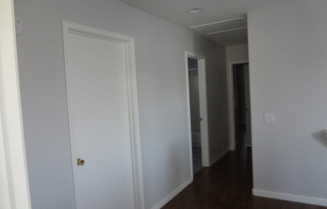 THIS 1,596 SQ. FT. HOME HAS 3 BEDROOMS, 2.5 BATHROOMS, A 2 CAR GARAGE LOCATED ON A CORNER LOT AND NEW WOOD FLOORING