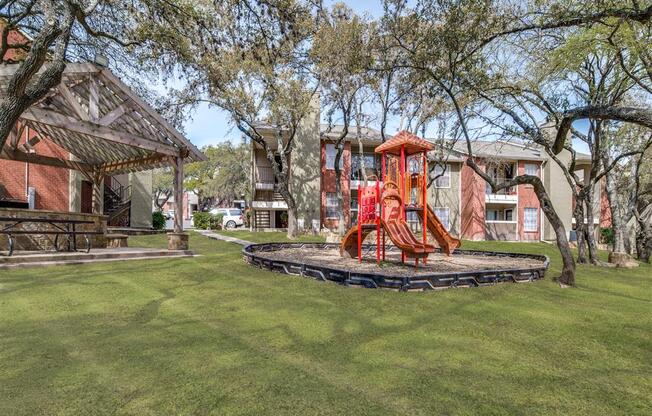 Tot Lot And Playing Field atWildwood Apartments, CLEAR Property Management, Austin, 78752