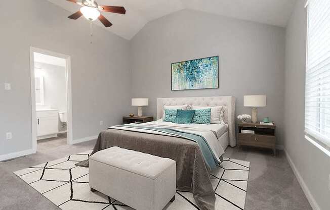 A bedroom with a bed, a bench, and a ceiling fan.