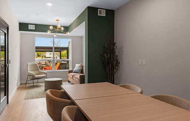 A conference room with a long table and chairs.