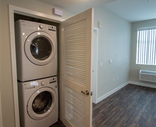 a washer and dryer in a small room at Loma Villas Apartments, San Bernardino, CA